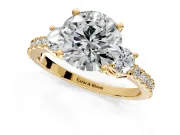 3 Stone Engagement Ring Setting for Round Cut Center with Round Cut Side Accents and Prong Head in Yellow Gold