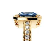 Milgrain Halo Engagement Ring Setting for Fancy Blue Emerald Cut Center with Wide Pave Band and Prong Head in Yellow Gold