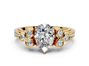 Cluster Engagement Ring Setting for Pear-Shaped Center with Bezel Accent Clusters and Prong Head in Yellow Gold