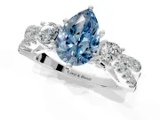 3 Stone Engagement Ring Setting for Fancy Blue Pear-Shaped Center with Pave Split Shank and Prong Head in White Gold
