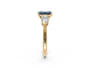 3 Stone Engagement Ring Setting for Fancy Blue Emerald Cut Center with Large Pear-Shaped Accents and Prong Head in Yellow Gold