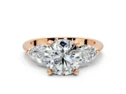 3 Stone Engagement Ring Setting for Round Cut Center with Large Pear-Shaped Accents and Prong Head in Rose Gold