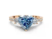 3 Stone Engagement Ring Setting for Fancy Blue Heart-Shaped Center with Round Cut Side Accents and Prong Head in Rose Gold