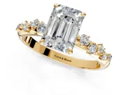 Cluster Engagement Ring Setting for Emerald Cut Center with Round Cut Accent Band and Prong Head in Yellow Gold