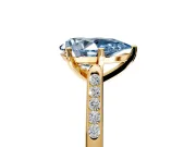Solitaire Engagement Ring Setting for Fancy Blue Pear-Shaped Center with Channel Accents and Prong Head in Yellow Gold
