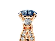 3 Stone Engagement Ring Setting for Fancy Blue Round Cut Center with Pave Twist Band and Prong Head in Rose Gold