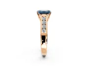 Solitaire Engagement Ring Setting for Fancy Blue Emerald Cut Center with Cathedral Channel Band and Prong Head in Rose Gold