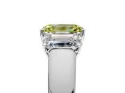 3 Stone Engagement Ring Setting for Fancy Yellow Emerald Cut Center with Raised Basket Heads and Prong Head in Platinum