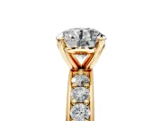 Solitaire Engagement Ring Setting for Round Cut Center with Channel-Set Accents and Prong Head in Yellow Gold