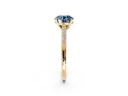 Solitaire Engagement Ring Setting for Fancy Blue Round Cut Center with Channel Accents and Prong Head in Yellow Gold