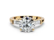 3 Stone Engagement Ring Setting for Round Cut Center with Channel Baguette Accents and Prong Head in Yellow Gold