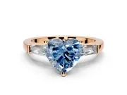 3 Stone Engagement Ring Setting for Fancy Blue Heart-Shaped Center with Tapered Baguettes, Plain Band and Prong Head in Rose Gold
