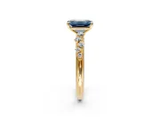 Cluster Engagement Ring Setting for Fancy Blue Emerald Cut Center with Round Cut Accent Band and Prong Head in Yellow Gold
