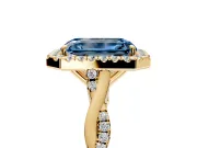 Halo Engagement Ring Setting for Fancy Blue Emerald Cut Center with Twist Band and Prong Head in Yellow Gold