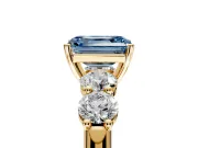 5 Stone Engagement Ring Setting for Fancy Blue Emerald Cut Center with Graduated Accents and Prong Head in Yellow Gold