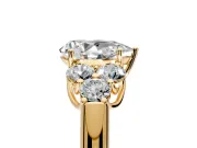 Cluster Engagement Ring Setting for Pear-Shaped Center with Round Cut Accent Frame and Prong Head in Yellow Gold