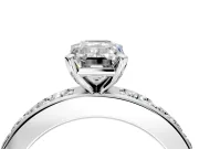 Solitaire Engagement Ring Setting for Emerald Cut Center with Channel-Set Accents and Prong Head in Platinum