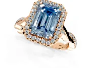 Halo Engagement Ring Setting for Fancy Blue Emerald Cut Center with Twist Band and Prong Head in Rose Gold