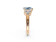 Cluster Engagement Ring Setting for Fancy Blue Pear-Shaped Center with Round Cut Accent Frame and Prong Head in Rose Gold