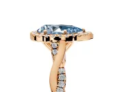 Halo Engagement Ring Setting for Fancy Blue Pear-Shaped Center with Twist Band and Prong Head in Rose Gold