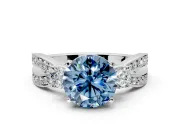 3 Stone Engagement Ring Setting for Fancy Blue Round Cut Center with Pave Twist Band and Prong Head in Platinum