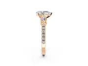 3 Stone Engagement Ring Setting for Pear-Shaped Center with Round Cut Side Accents and Prong Head in Rose Gold