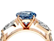 Channel-Set Engagement Ring Setting for Fancy Blue Round Cut Center with Baguette Band and Prong Head in Rose Gold