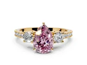 3 Stone Engagement Ring Setting for Fancy Pink Pear-Shaped Center with Round Cut Side Accents and Prong Head in Yellow Gold