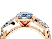 Channel-Set Engagement Ring Setting for Fancy Blue Pear-Shaped Center with Baguette Band and Prong Head in Rose Gold