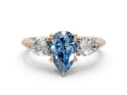 3 Stone Engagement Ring Setting for Fancy Blue Pear-Shaped Center with Large Pear-Shaped Accents and Prong Head in Rose Gold