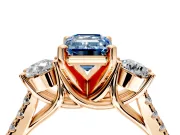 3 Stone Engagement Ring Setting for Fancy Blue Emerald Cut Center with Crossover Basket, Pave Band and Prong Head in Rose Gold