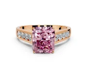 Solitaire Engagement Ring Setting for Fancy Pink Radiant Cut Center with Round Cut Channel Band and Prong Head in Rose Gold