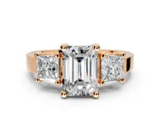 3 Stone Engagement Ring Setting for Emerald Cut Center with Matching Side Accents and Prong Head in Rose Gold