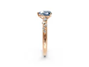 Cluster Engagement Ring Setting for Fancy Blue Heart-Shaped Center with Round Cut Accent Band and Prong Head in Rose Gold