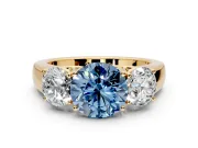 3 Stone Engagement Ring Setting for Fancy Blue Round Cut Center with Raised Basket Heads and Prong Head in Yellow Gold