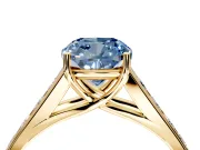 Solitaire Engagement Ring Setting for Fancy Blue Cushion Cut Center with Round Cut Channel Band and Prong Head in Yellow Gold