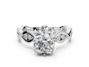 Solitaire Engagement Ring Setting for Radiant Cut Center with Accented Twist Band and Leaf Prong Head in Platinum
