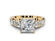 Solitaire Engagement Ring Setting for Princess Cut Center with Graduated Shared Prongs and Prong Head in Yellow Gold