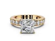 Solitaire Engagement Ring Setting for Princess Cut Center with Channel-Set Accents and Prong Head in Yellow Gold