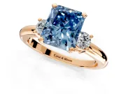 3 Stone Engagement Ring Setting for Fancy Blue Radiant Cut Center with Wide Plain Band and Prong Head in Rose Gold