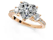 3 Stone Engagement Ring Setting for Heart-Shaped Center with Round Cut Side Accents and Prong Head in Rose Gold
