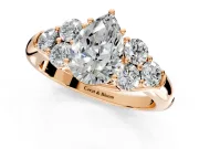 Cluster Engagement Ring Setting for Pear-Shaped Center with Round Cut Accent Frame and Prong Head in Rose Gold