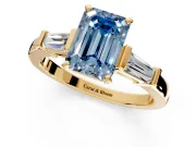 3 Stone Engagement Ring Setting for Fancy Blue Emerald Cut Center with Channel Baguette Accents and Prong Head in Yellow Gold