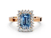 Starburst Halo Engagement Ring Setting for Fancy Blue Emerald Cut Center with Flat Cathedral Band and Prong Head in Rose Gold
