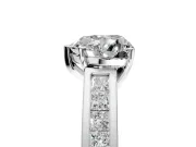Solitaire Engagement Ring Setting for Heart-Shaped Center with Princess Cut Channel Band and Prong Head in Platinum