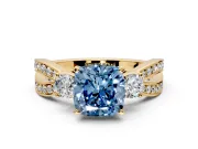 3 Stone Engagement Ring Setting for Fancy Blue Cushion Cut Center with Pave Twist Band and Prong Head in Yellow Gold