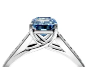 Solitaire Engagement Ring Setting for Fancy Blue Emerald Cut Center with Round Cut Channel Band and Prong Head in Sterling Silver
