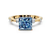 Solitaire Engagement Ring Setting for Fancy Blue Princess Cut Center with Bezel Station Band and Prong Head in Yellow Gold
