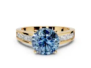 Solitaire Engagement Ring Setting for Fancy Blue Round Cut Center with Princess Cut Channel Band and Prong Head in Yellow Gold