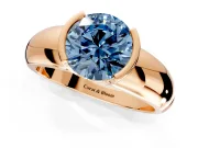 Tension Engagement Ring Setting for Fancy Blue Round Cut Center with Wide Flat Band and Tension Head in Rose Gold